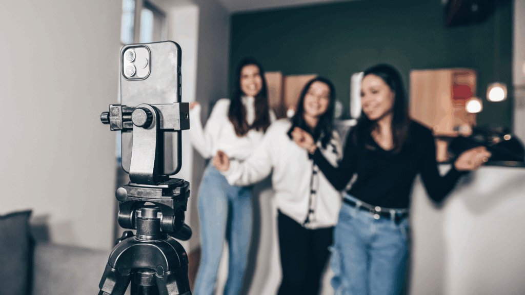 A group of three women is recording content to use for TikTok Ads.