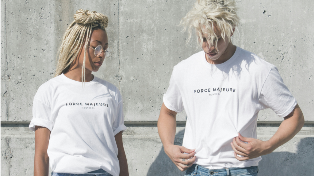 Two individuals in matching t-shirts displaying the phrase.