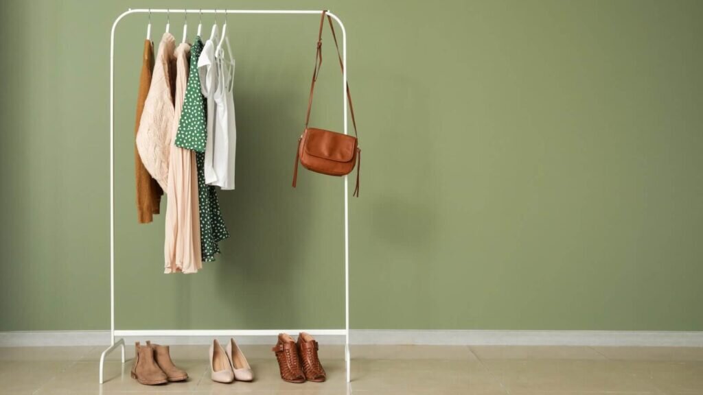 A clothing rack full of various garments and accessories.