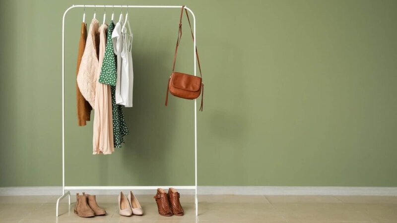 A clothing rack full of various garments and accessories.