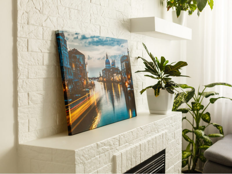 A beautiful canvas of Venice's skyline is displayed on the wall of a contemporary living room.