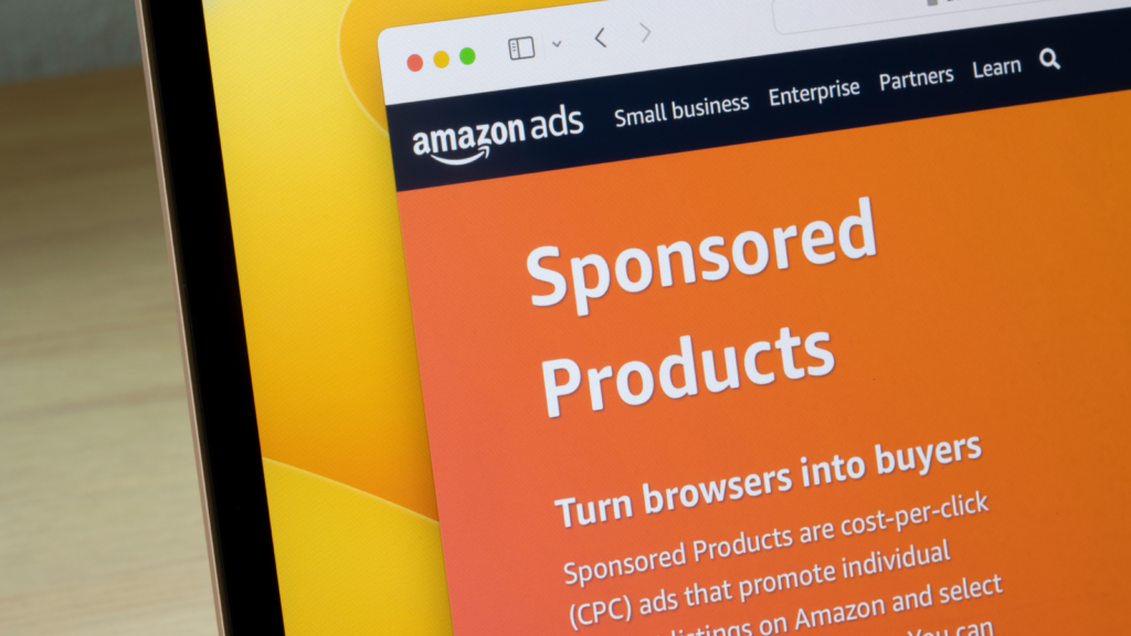 A picture of a laptop’s screen corner, with the Amazon Ads page on the screen.