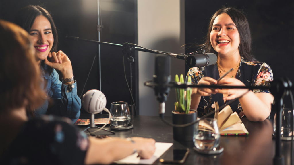A group of women talking mid-podcast.