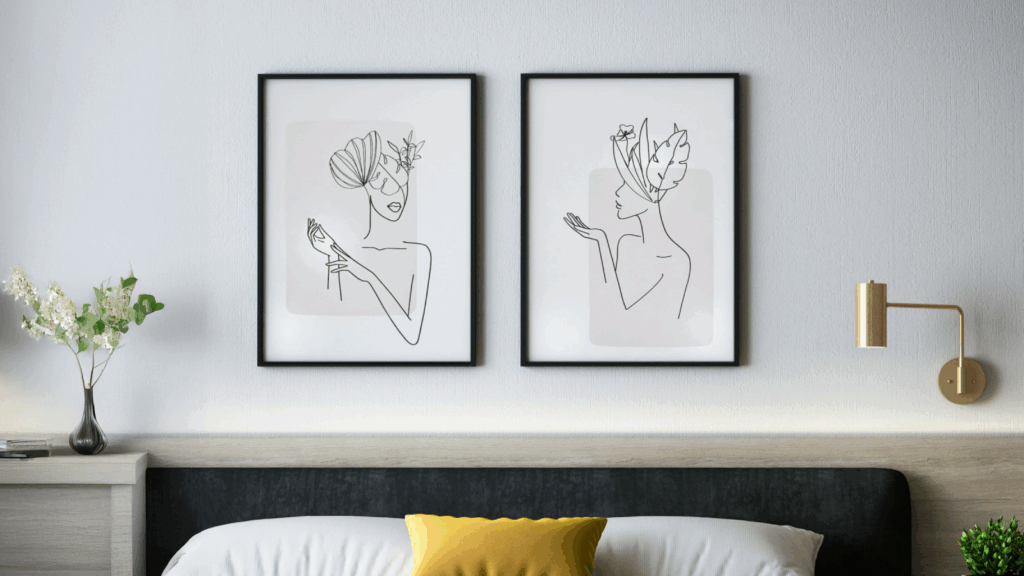 Modern bedroom featuring two framed artworks displayed on the wall, enhancing the contemporary decor.