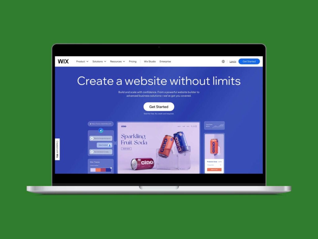 A screenshot of the Wix homepage hero section on a laptop screen with a green background.