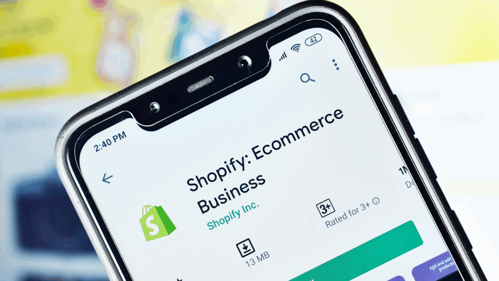 Shopify logo with a shopping cart, representing eCommerce solutions for online businesses.