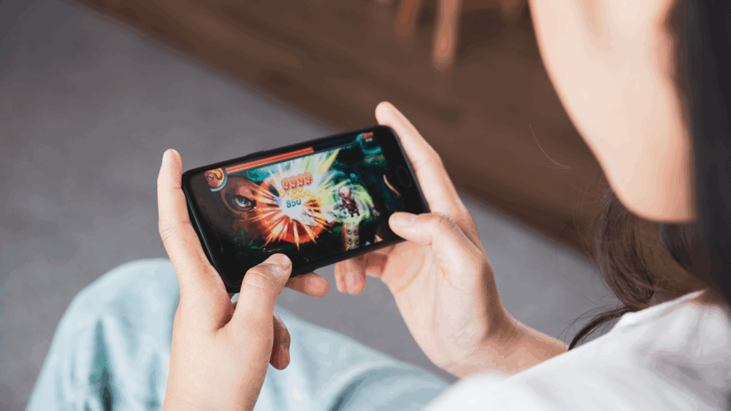 A person is playing games on the phone.