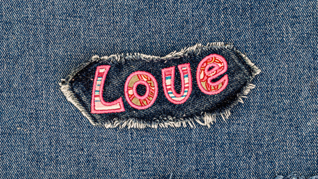 An iron-on patch saying Love.