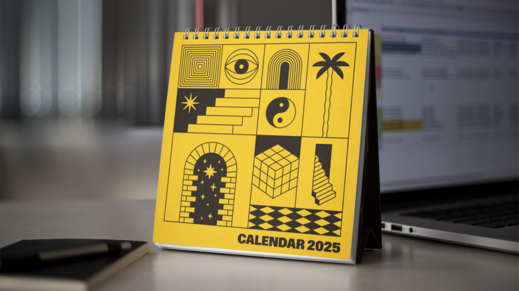 A yellow calendar with custom illustrations printed on the cover page.
