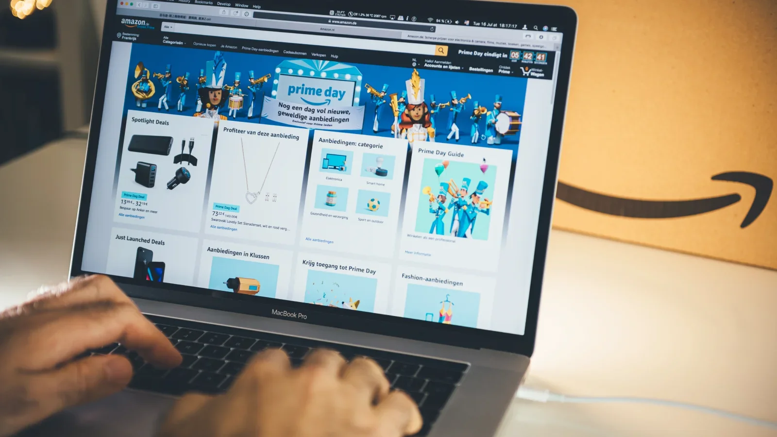 A person browsing Amazon using a laptop.