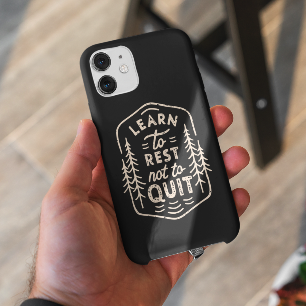 A custom black “Learn to rest, not to quit” phone case.