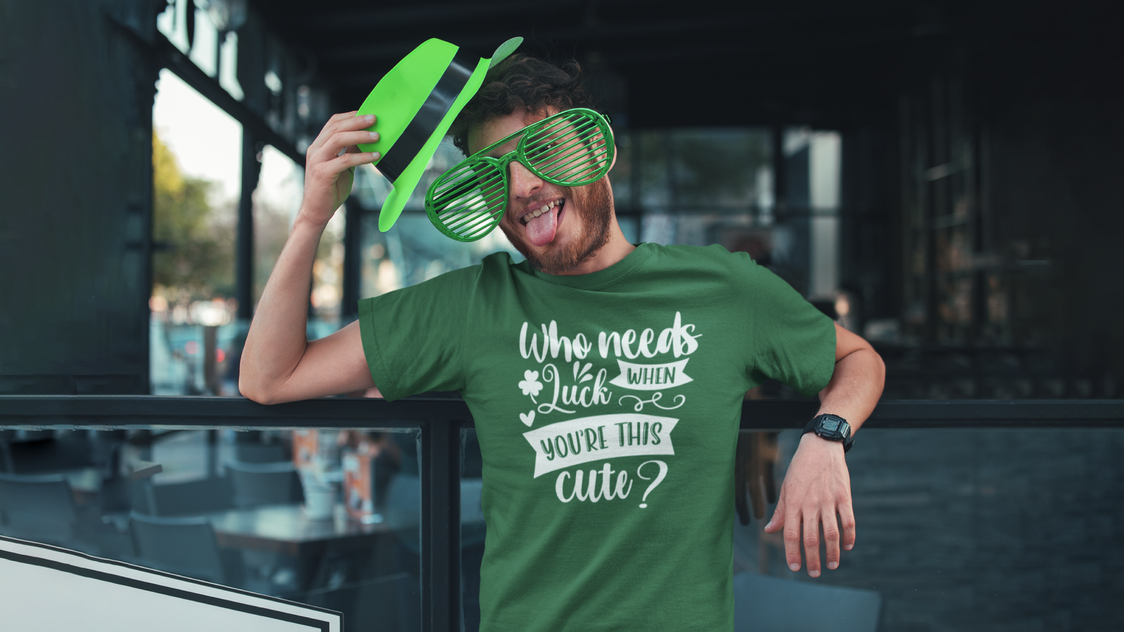 A man in a green shirt St Patrick’s Day shirt with a "Who needs a St. Patrick's Day party?" print.