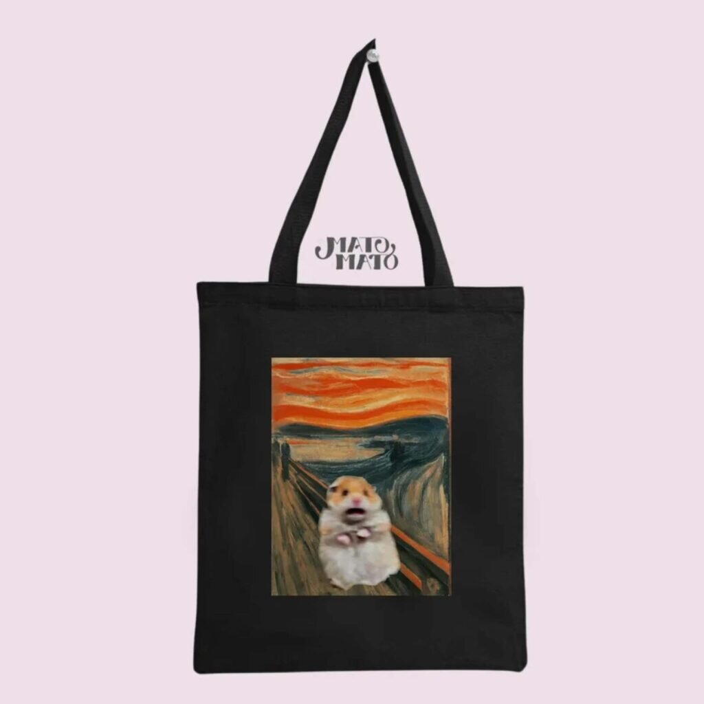 A tote bag with the scared meme hamster on the background of Edvard Munch’s “Scream” painting.