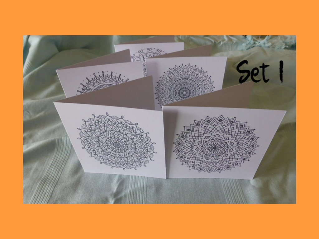 A set of mandala-painted greeting cards.