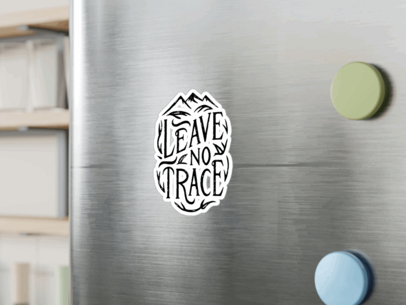 A circular sticker featuring the phrase Leave No Trace with a nature-themed design, promoting environmental responsibility