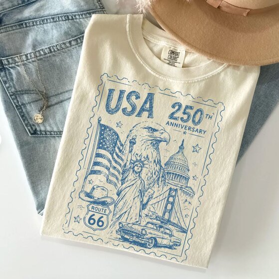A woman wearing a white 4th of July t-shirt  with a patriotic design