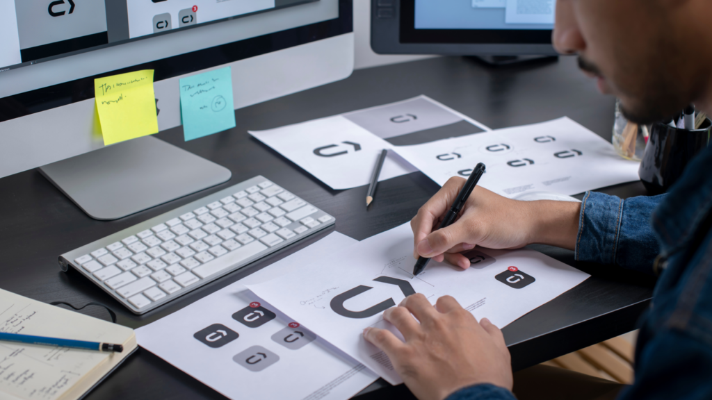 A man developing branding elements for a business.