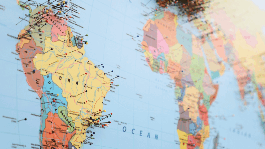 A world map featuring multiple pins indicating various locations across different countries.