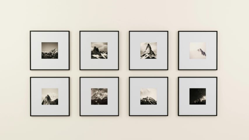 A wall with printed artwork.