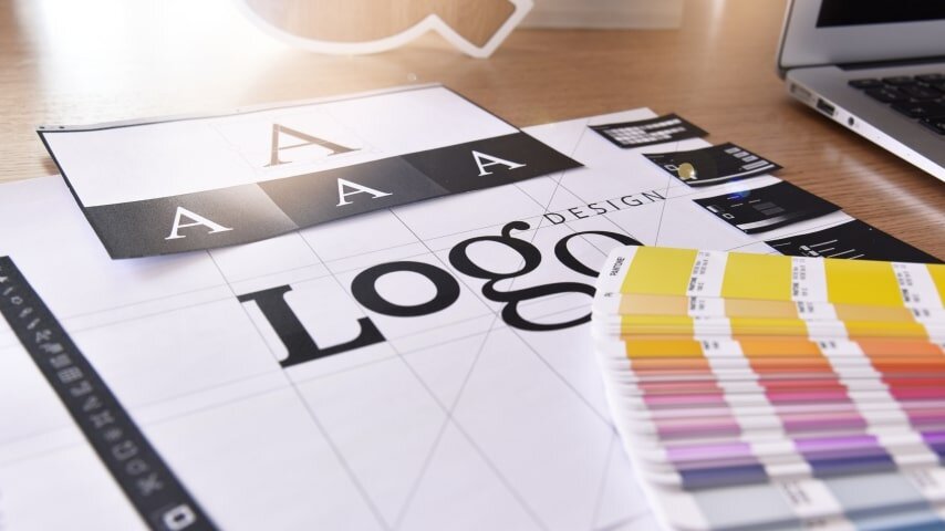 A collection of font and color samples for a company logo.