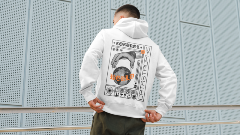 A backshot of a man wearing a white hoodie with a full world control-themed print.