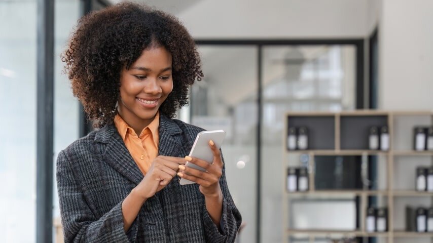 A woman learning how to sell on Etsy with Printify.