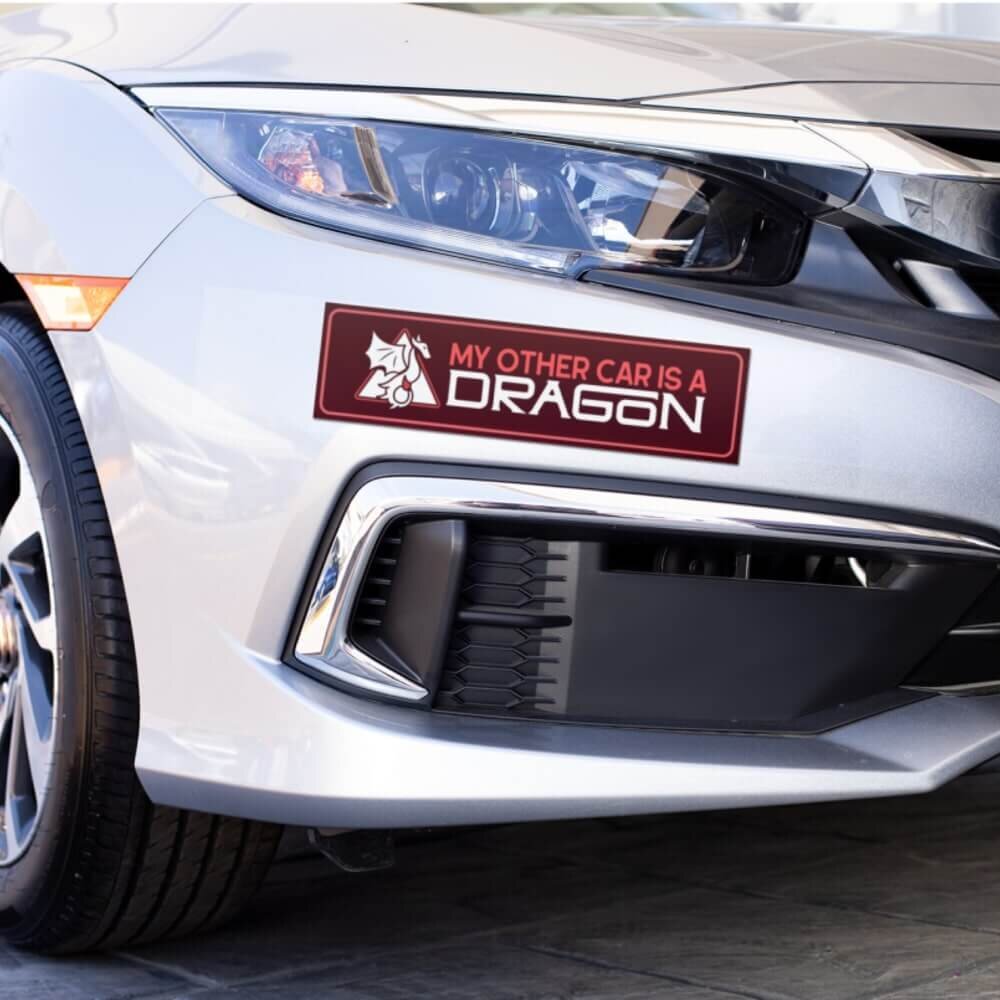 A car with a custom made bumper sticker on it.