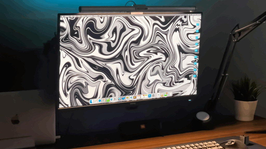 A monitor with an abstract black and white background.