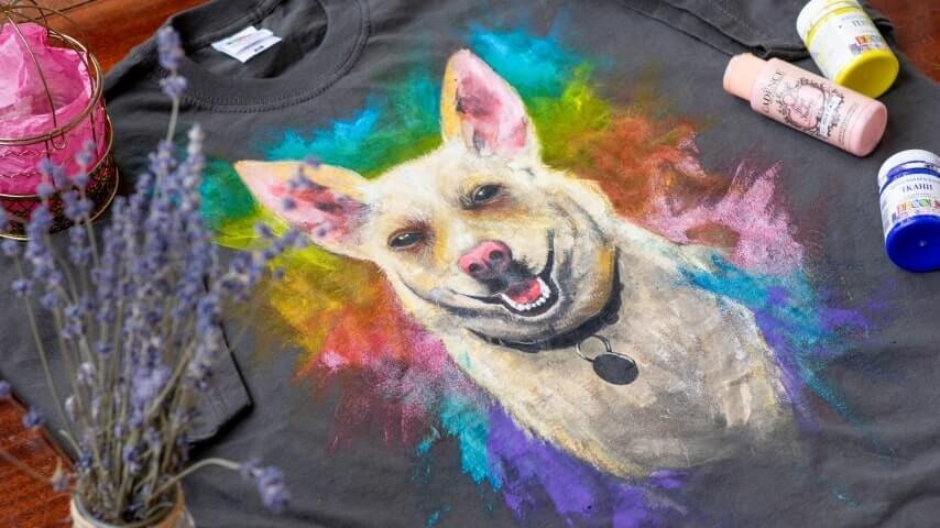 A t-shirt with a colorful print of a dog on.