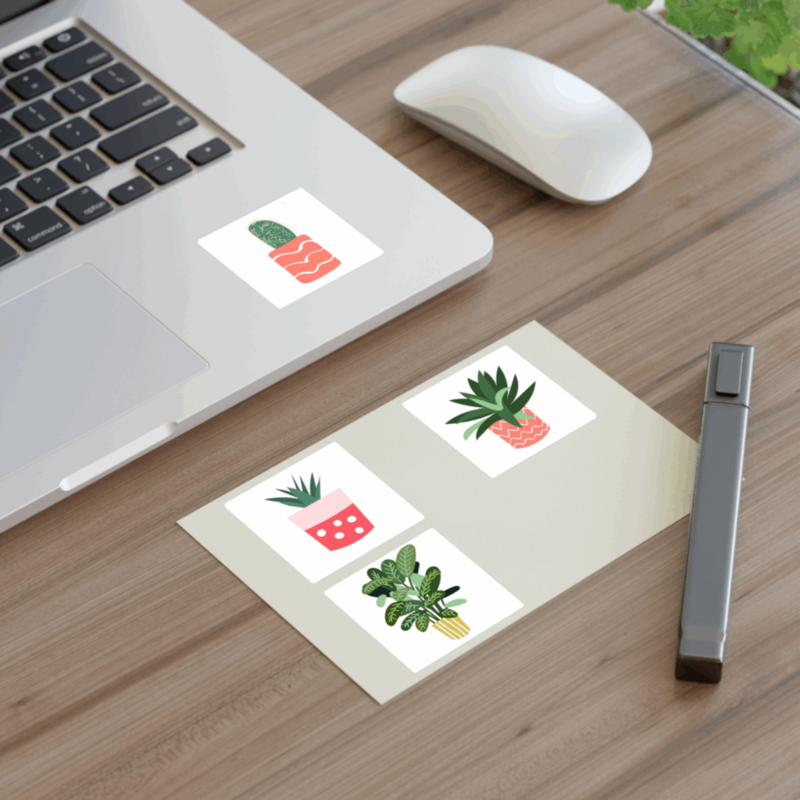 A laptop adorned with various plant-themed stickers, showcasing a vibrant and nature-inspired design