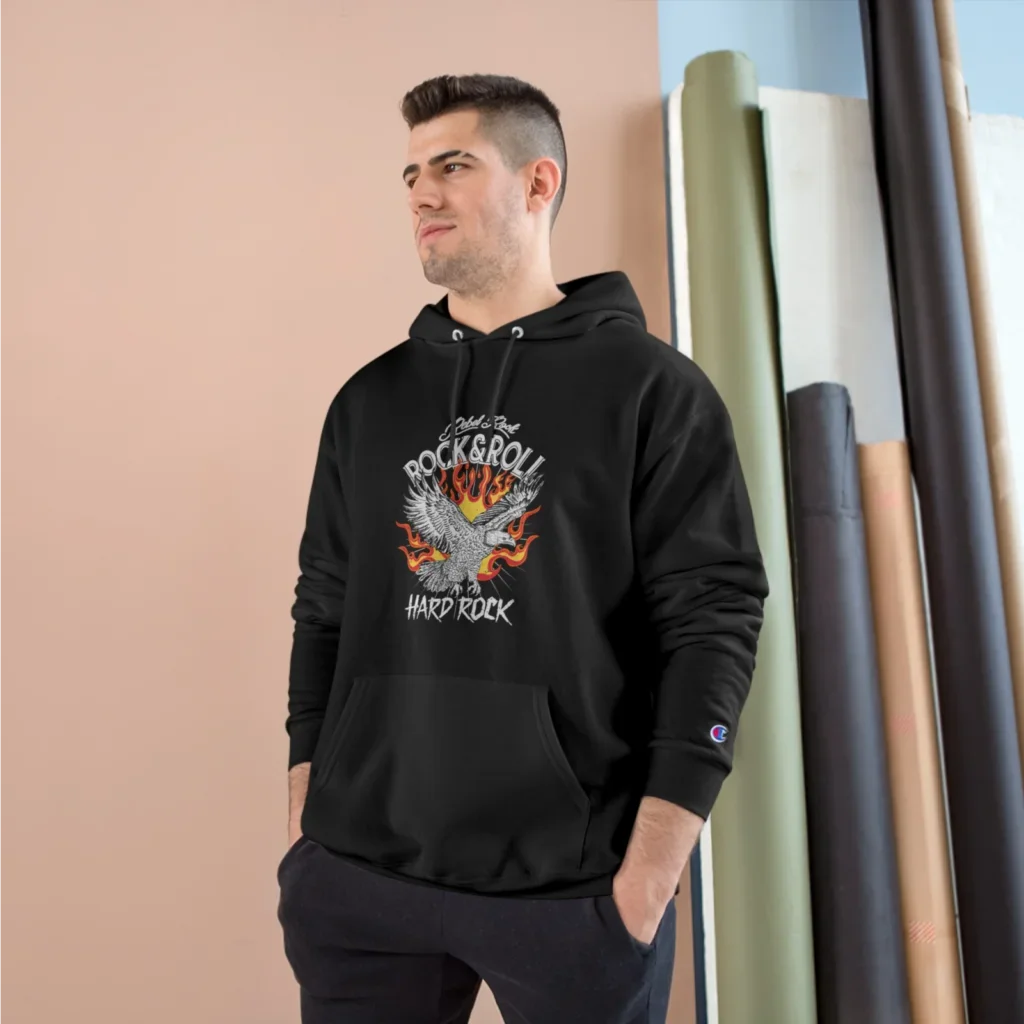 A man in a black hoodie with a “Rock&Roll”, an illustrated eagle, and a “Hard Rock” print.