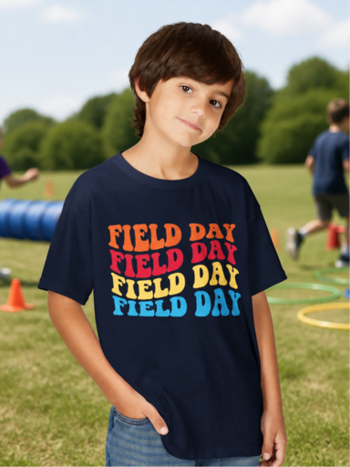 Boy wearing a colorful Field Day t-shirt outdoors
