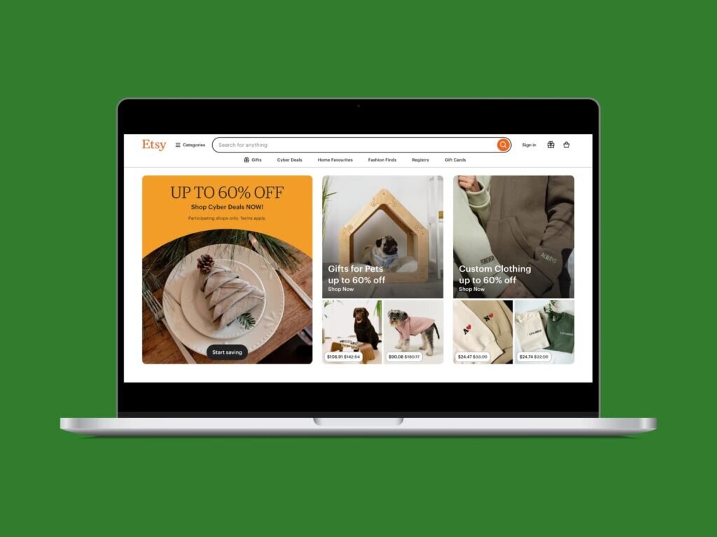 A screenshot of the Etsy homepage on a laptop screen with a green background.