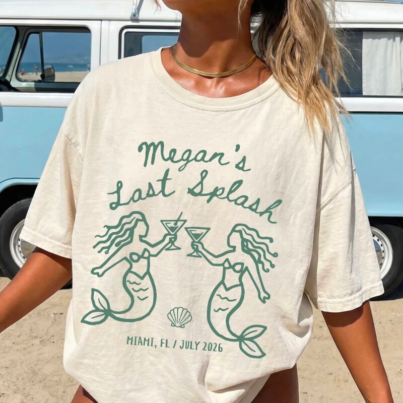 A woman in a t-shirt reading "Megan's Last Splash," smiling and standing outdoors.