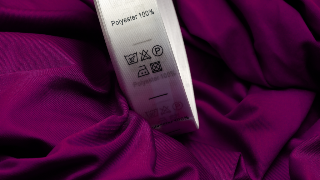 A polyester fabric with a “Polyester 100%” tag.