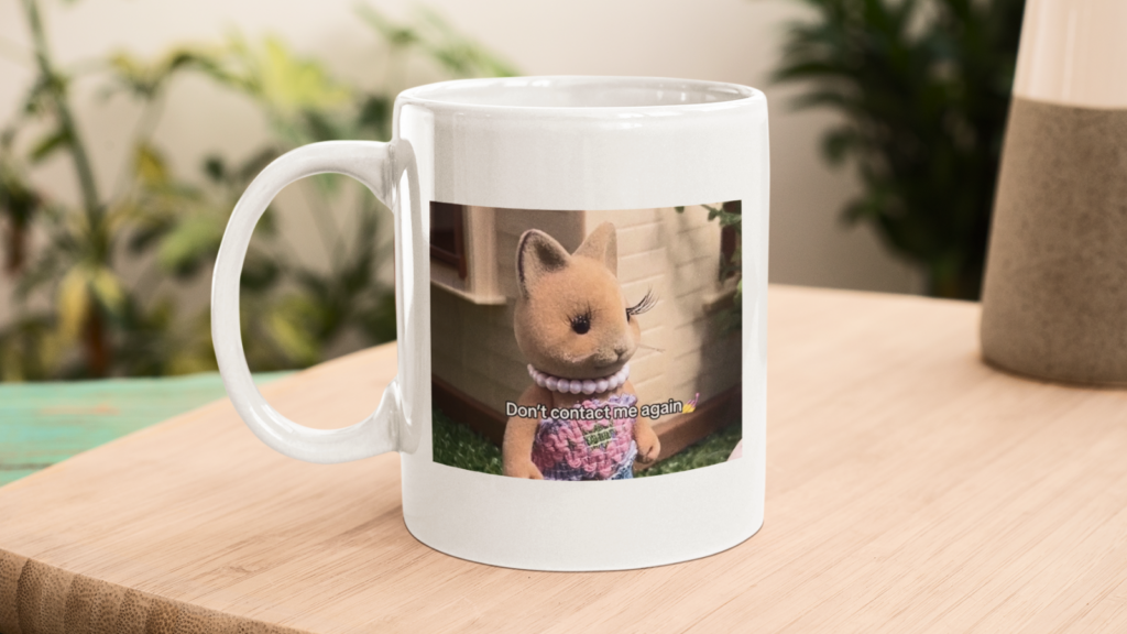 White mug with a photo of a toy kangaroo wearing a dress and pearl necklace. The text reads "Don't contact me again".