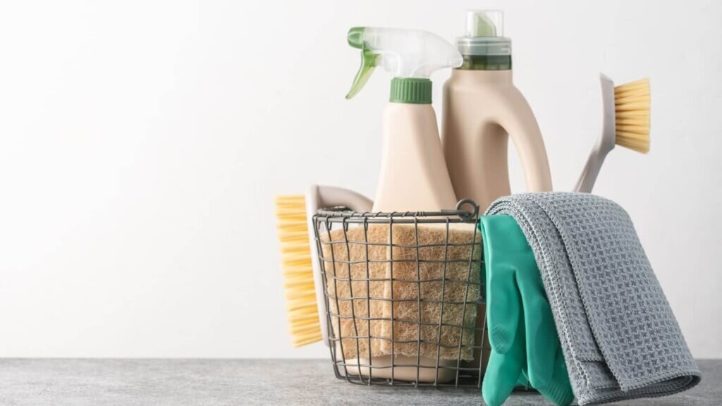 A basket filled with cleaning supplies.