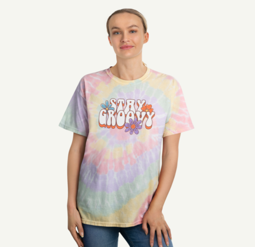 A woman wearing a tie-dye shirt with a text print.