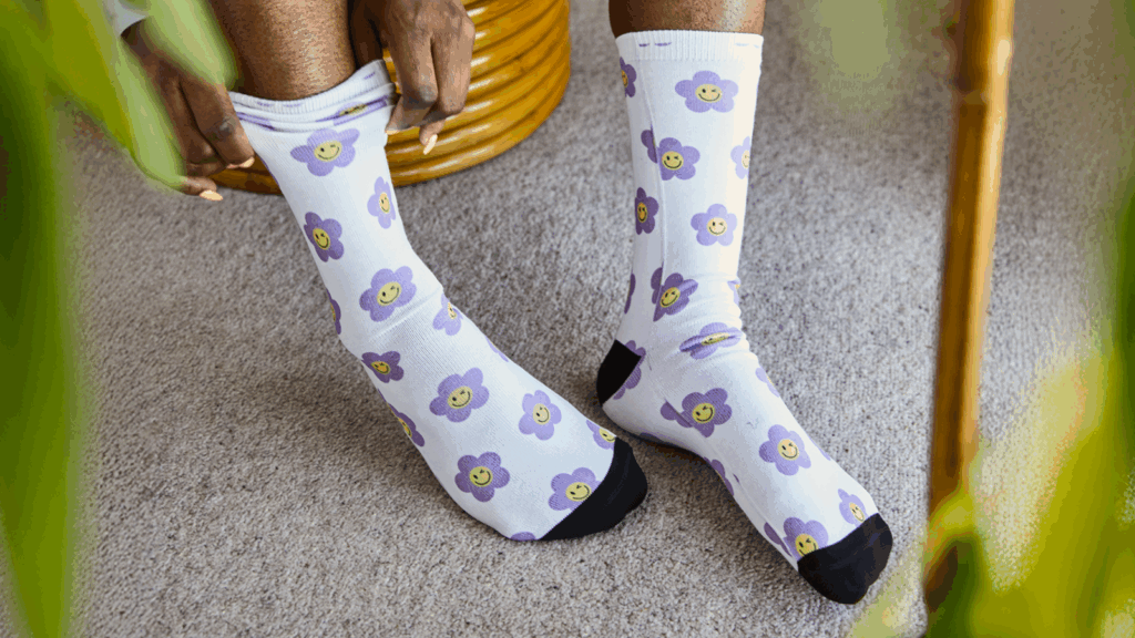 Custom all-over-print socks with a floral pattern.