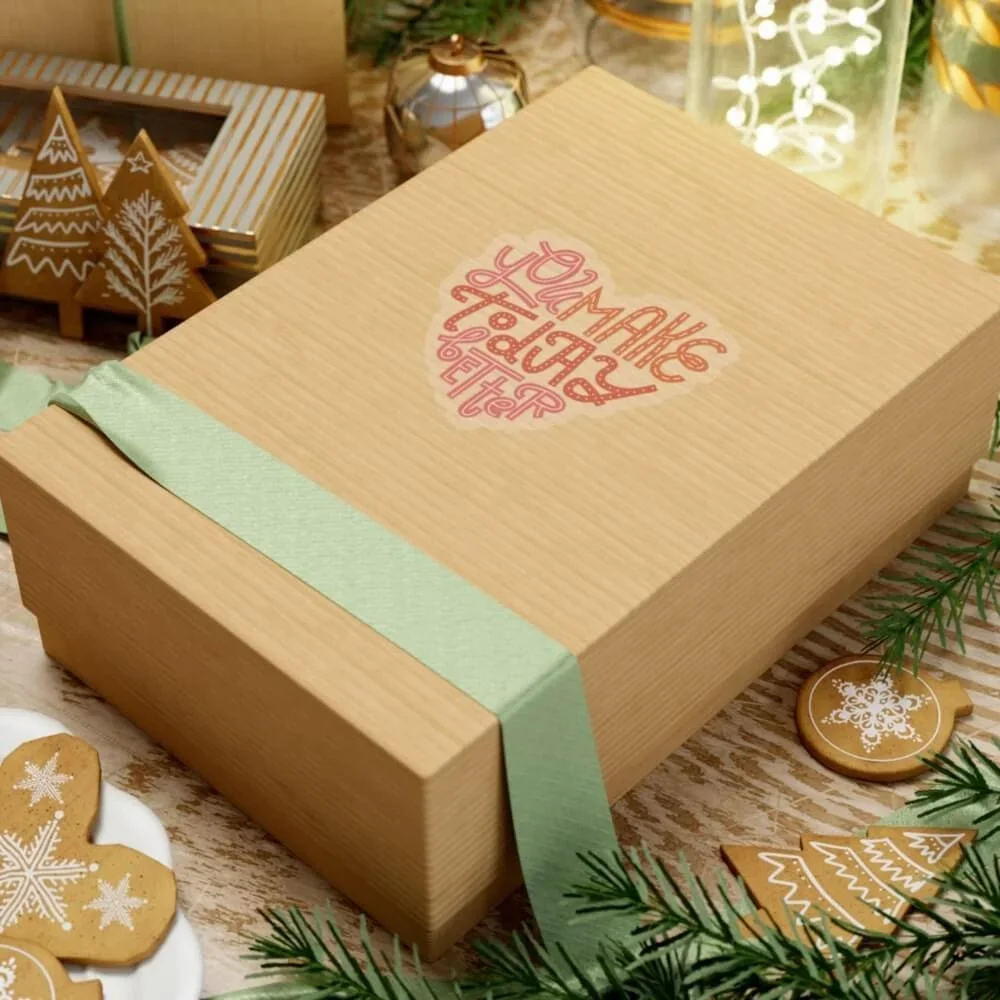 A gift box with a patterned kiss-cut sticker on it.