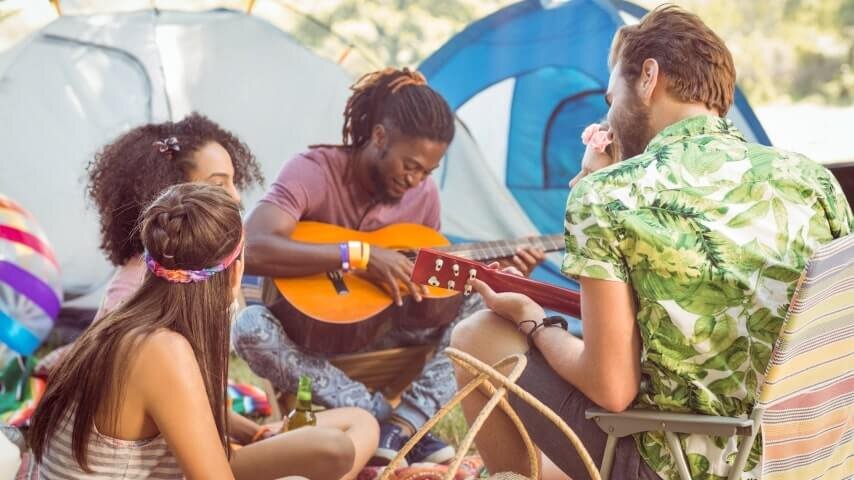 A group of young people camping out at a local music festival.