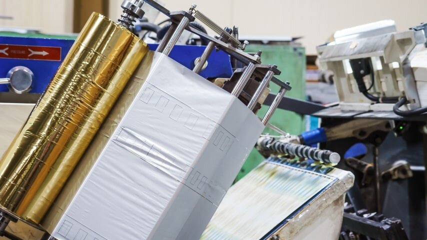 The process of foil printing, as an alternative to screen printing.