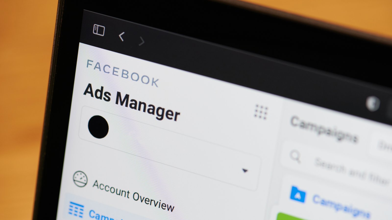 Facebook Ads Manager dashboard on a laptop screen.