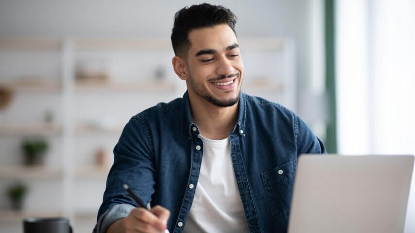 A man working on his Shopify store's referral marketing.