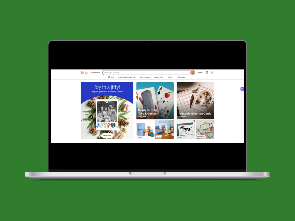 A laptop with an Etsy landing page on it.