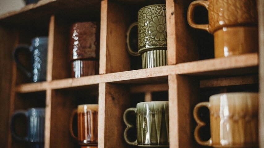 Mugs placed in shelves. 