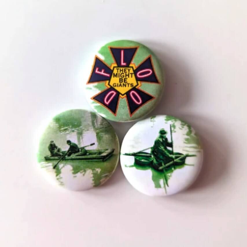 They Might Be Giants' “Flood” merch pins.