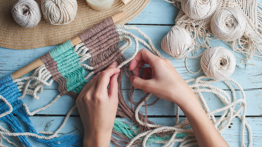 A person creating handmade goods to make extra income while working full-time.