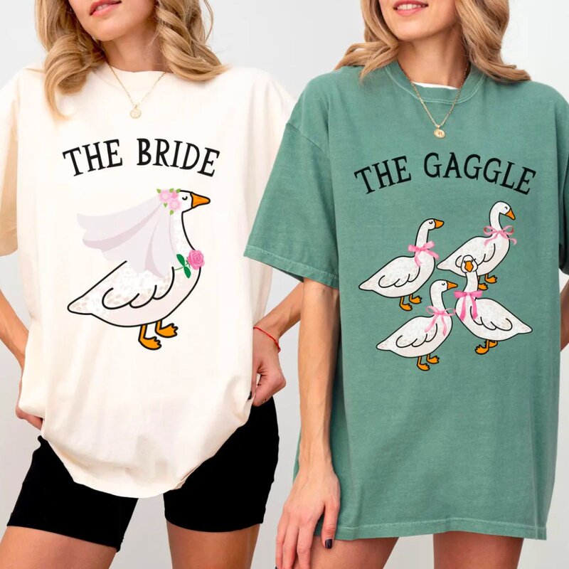 A group of people wearing matching "The Bride" and "Gaggle" t-shirts, celebrating a wedding event together.