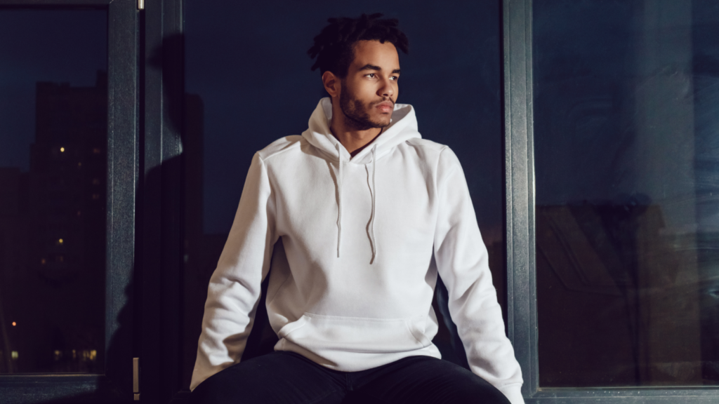A man in a white hoodie.